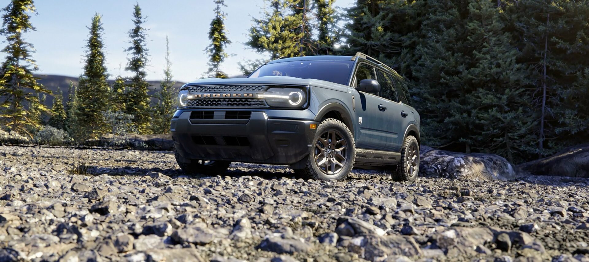 A 2026 Ford Bronco Sport Big Bend on a rocky trail among pines