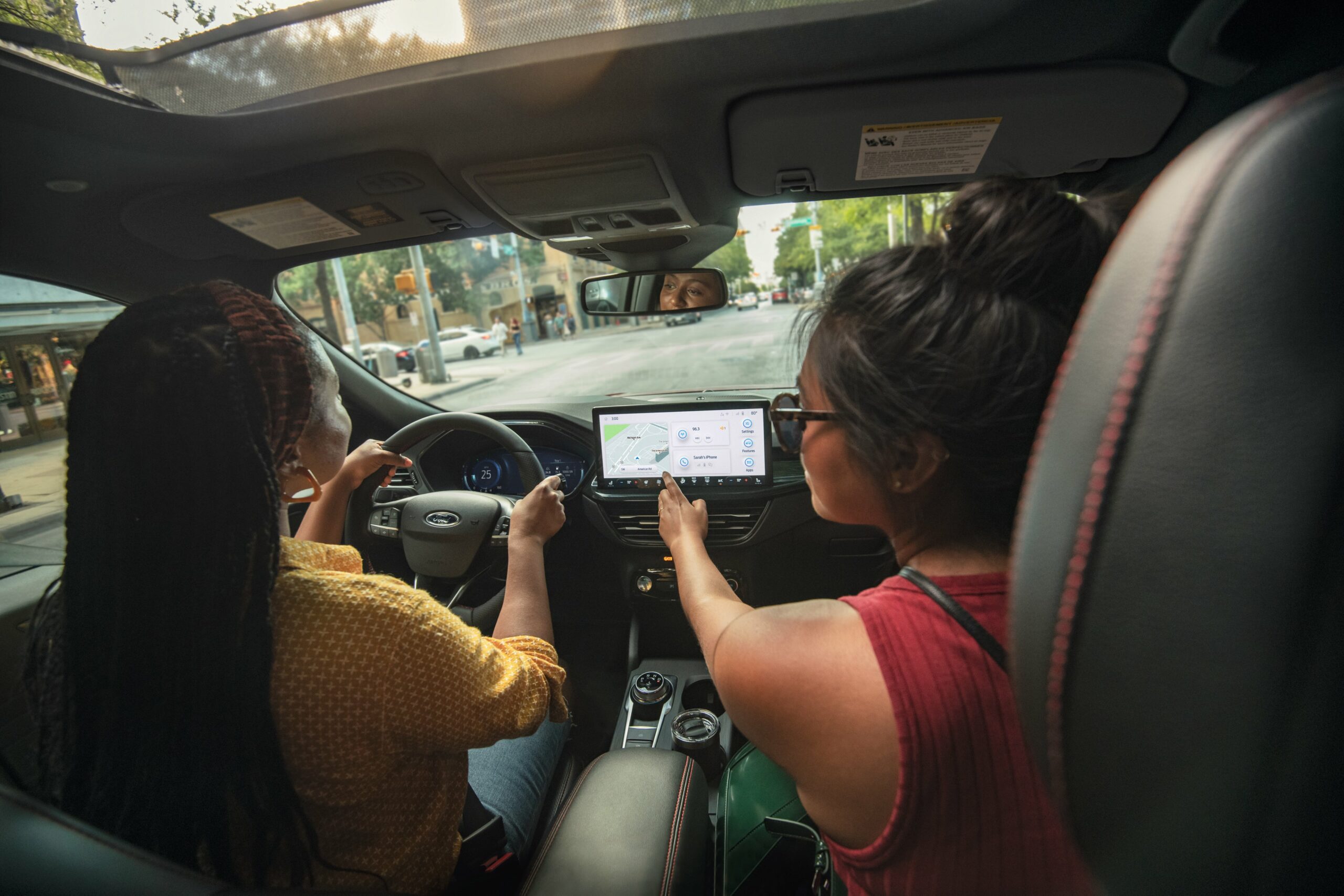 The dashboard, center touchscreen, and front seats of a 2026 Ford Escape