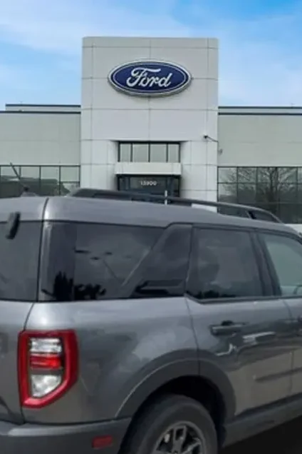 The Ford sign above the entrance at Huntley Ford on Automall Drive